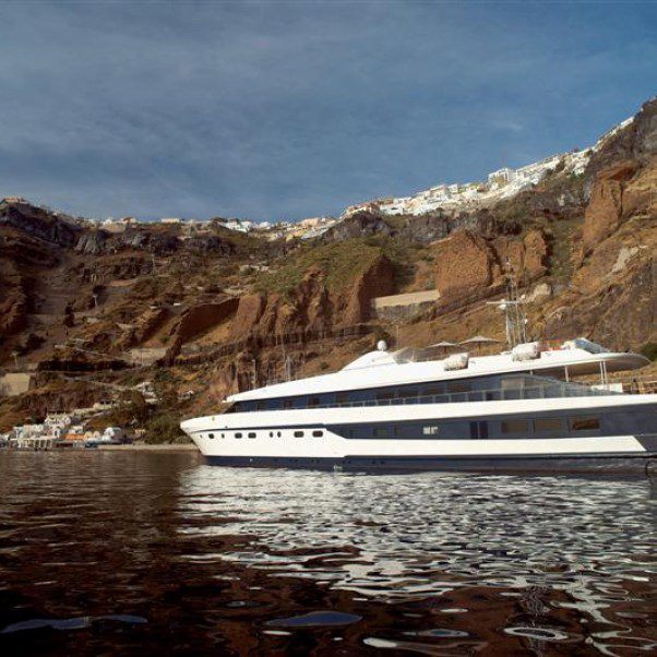 The Harmony G in front of the island Santorini